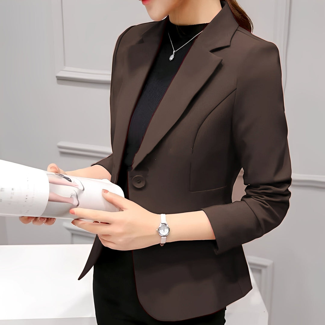 Female model showcasing a smart tailored blazer designed for office and event wear.