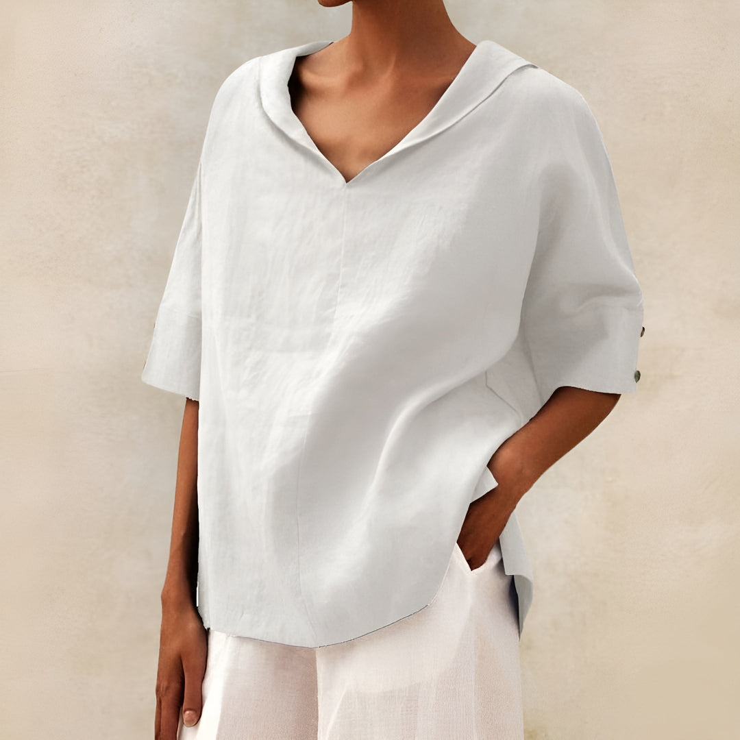 Female wearing a lightweight relaxed-fit blouse against a plain background.