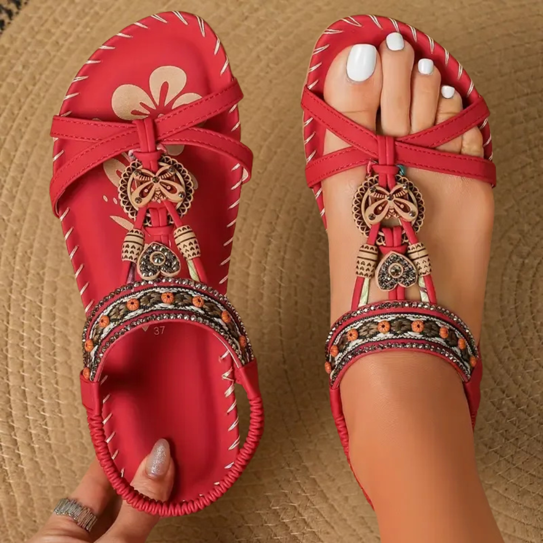 Woman modeling casual summer sandals with a clean plain background.