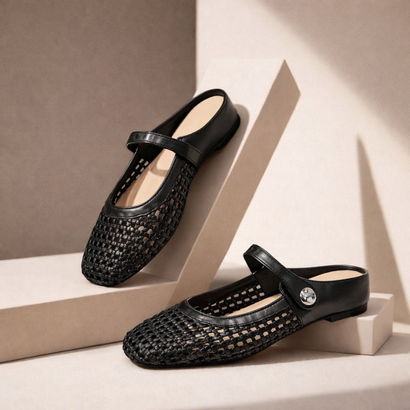 Strap mule flats with a square toe on a plain background.
