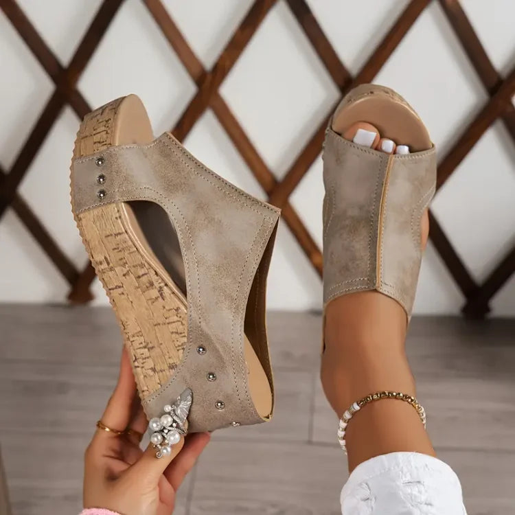 Female showcasing lightweight sandals designed for daily wear on a plain background.