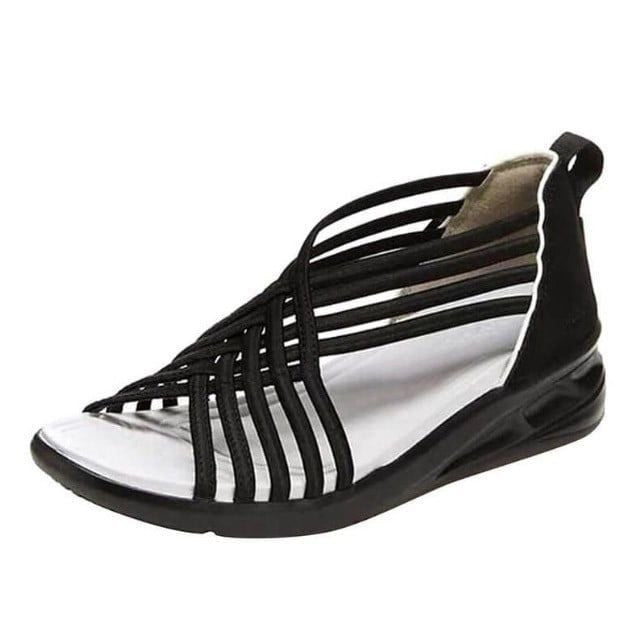 Open-toe sandals with a plain background.