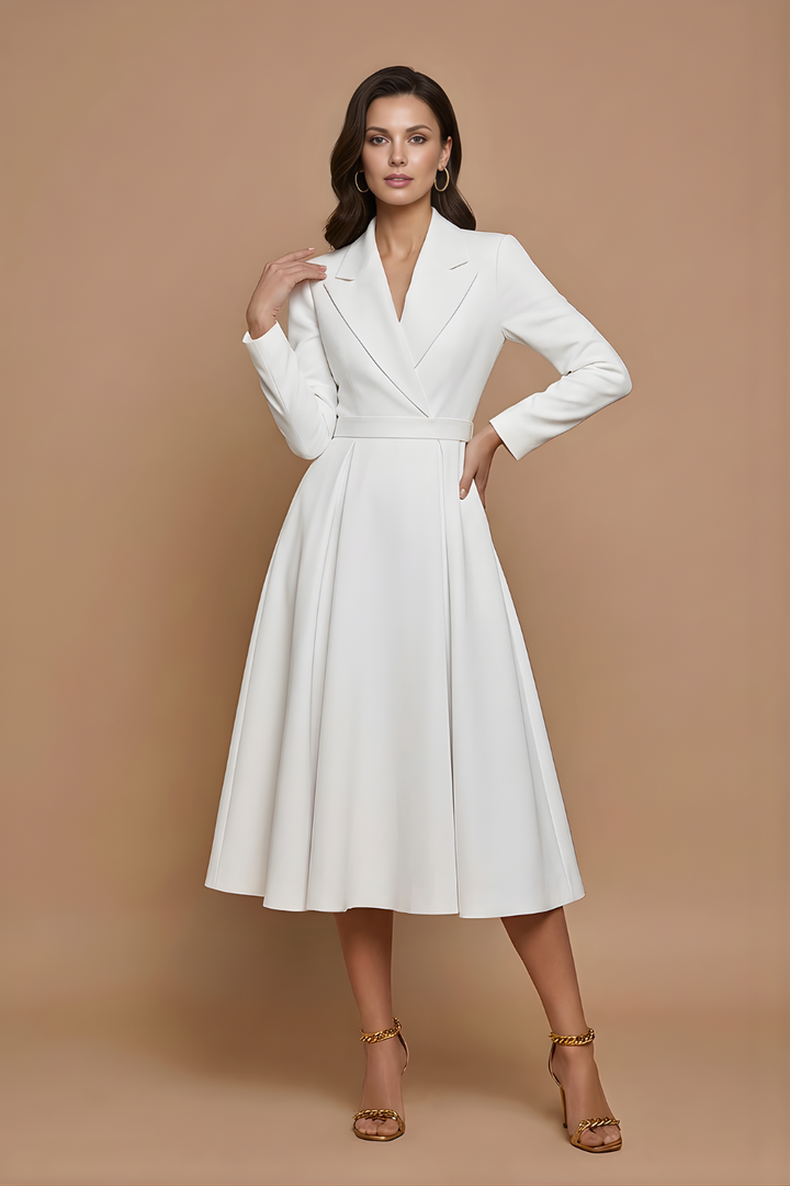 Female modelling a notched lapel dress with defined waist seam.