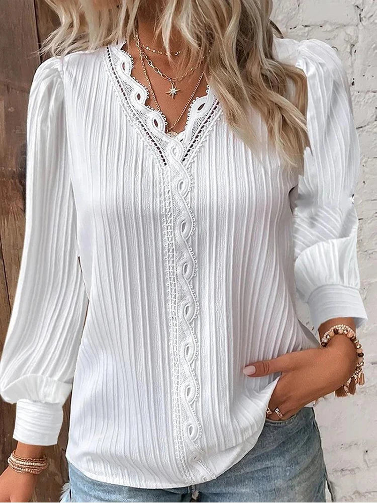 Female in a lightweight lace-trim blouse with a relaxed everyday fit.