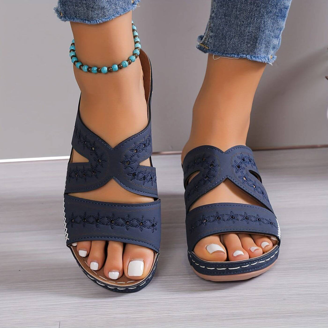 Woman modelling lightweight sandals with open-toe styling.