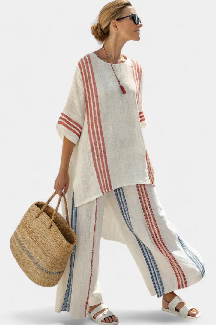 Woman styling a matching two piece outfit on a plain background.