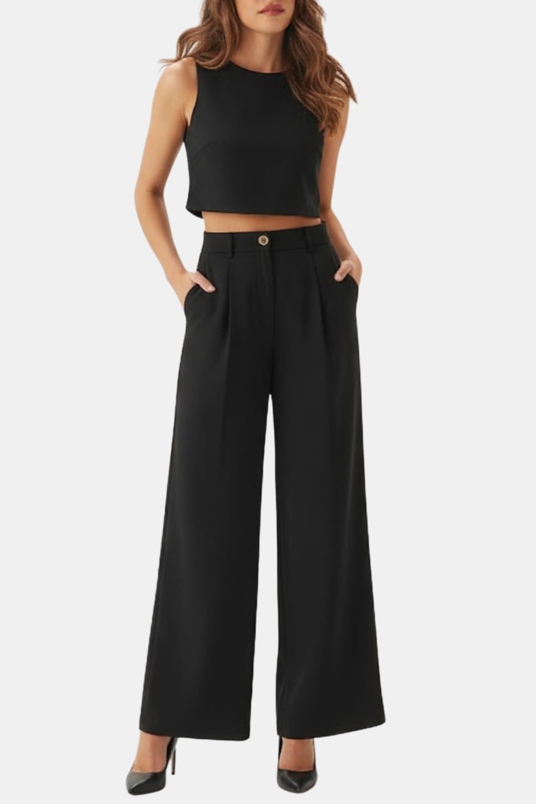 Female model wearing a sleeveless crop top and wide-leg pants set against a plain background.