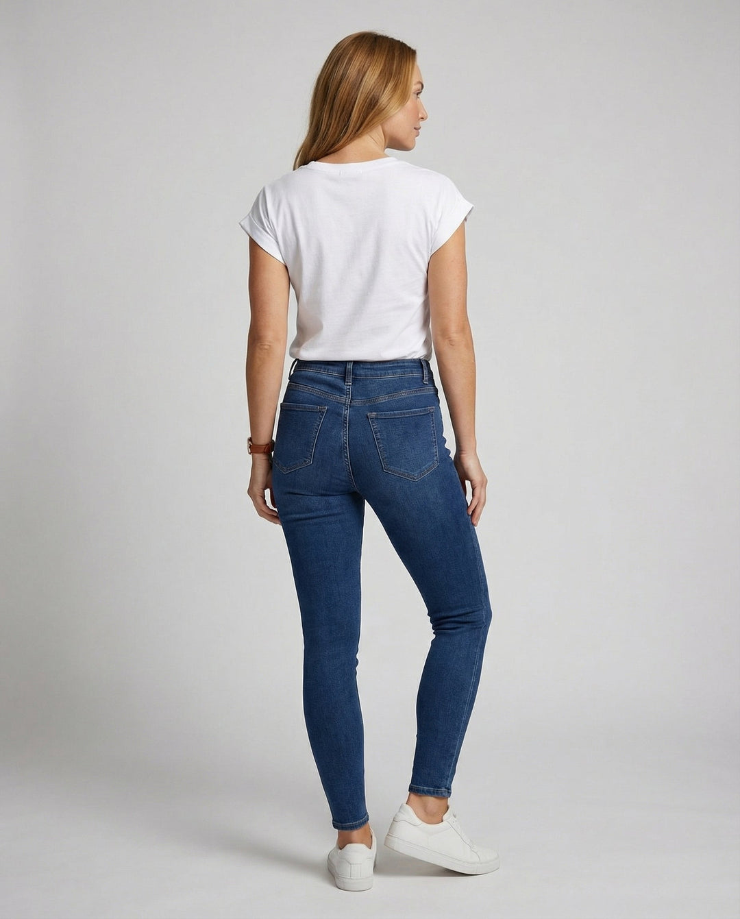 Female wearing a loose fit summer top with short sleeves.