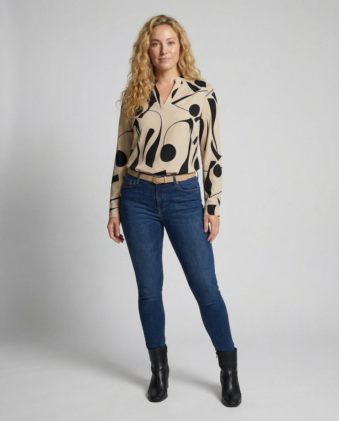 Female modelling a stylish blouse with a relaxed flattering fit.