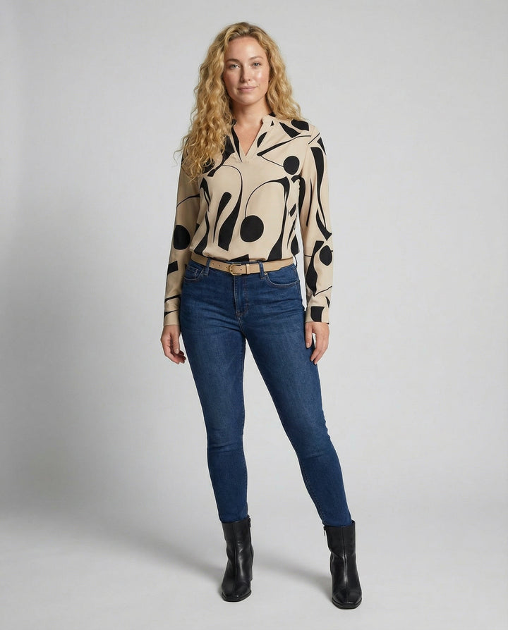 Female modelling a stylish blouse with a relaxed flattering fit.