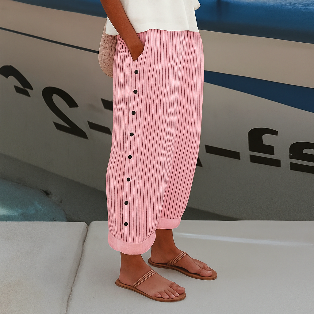 Female wearing striped trousers with a comfortable straight-leg silhouette.