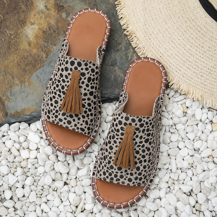 Open-toe sandals against a plain background.