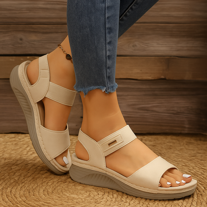 Woman modelling strappy sandals designed for everyday styling.