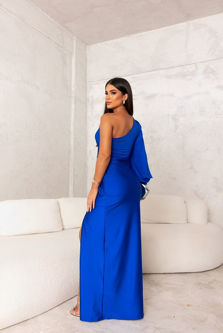 Female model wearing a modern one-shoulder dress on a plain background.