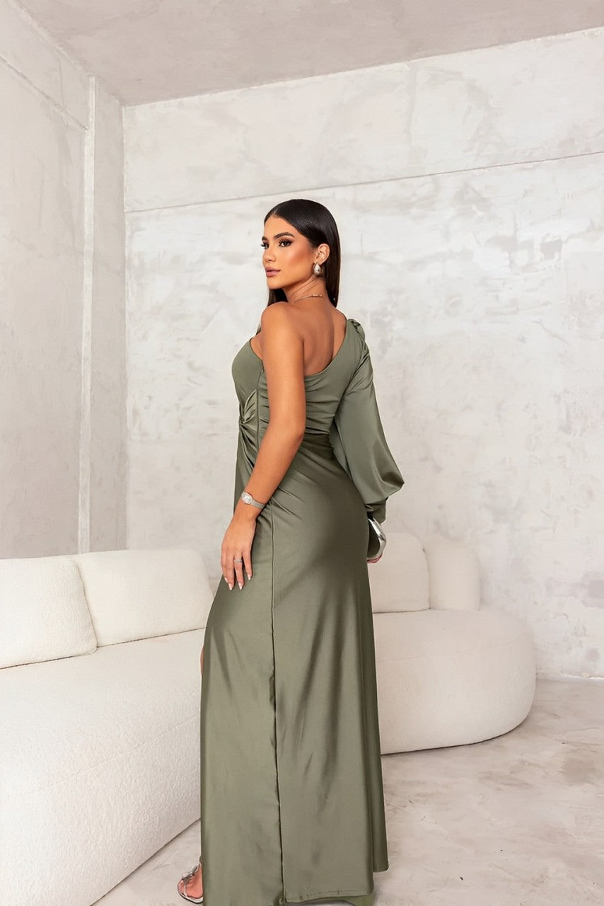 Model wearing a gala-ready one-shoulder dress on a plain background.