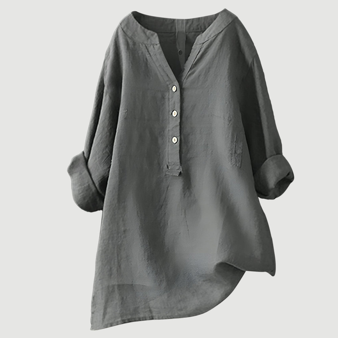 Casual linen top with a clean plain backdrop.