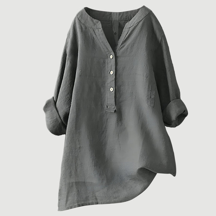 Casual linen top with a clean plain backdrop.