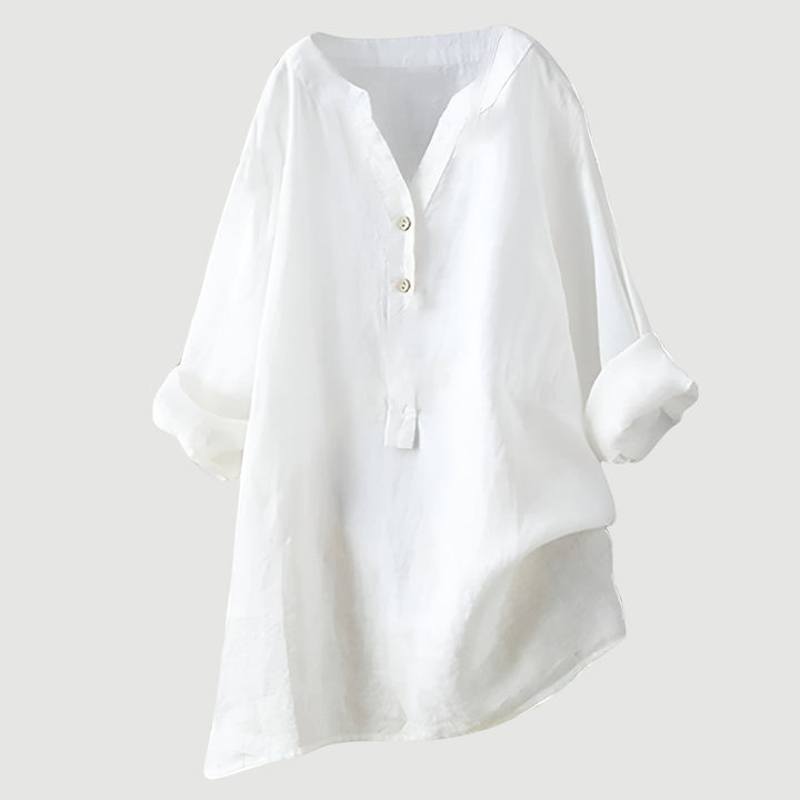 Airy linen top against a plain background.