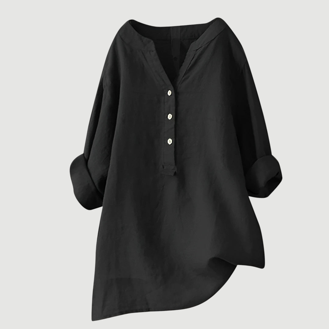 Loose-fit linen top shown on a plain background.