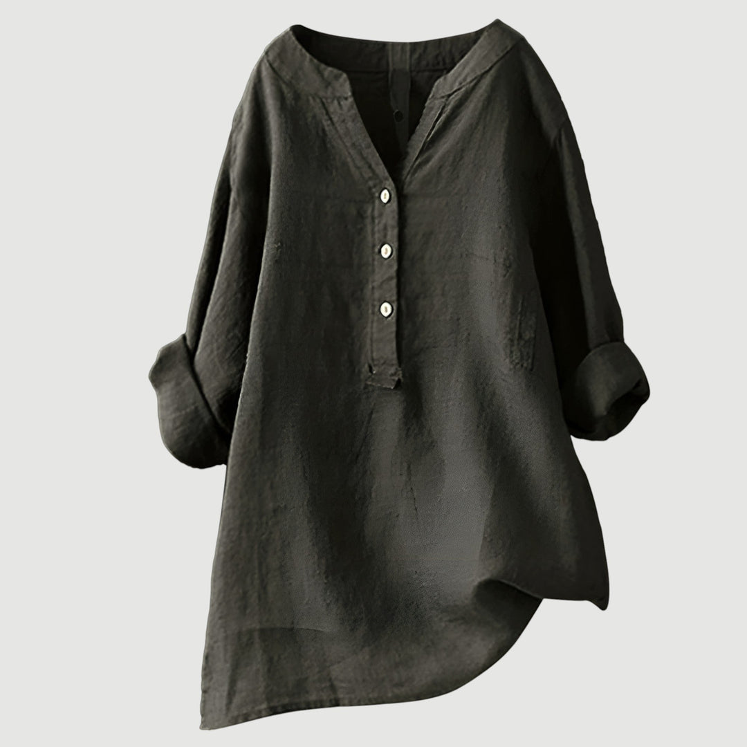 Lightweight linen top against a plain backdrop.