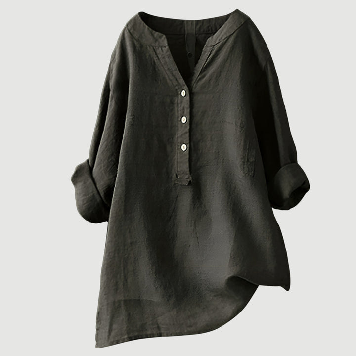 Lightweight linen top against a plain backdrop.