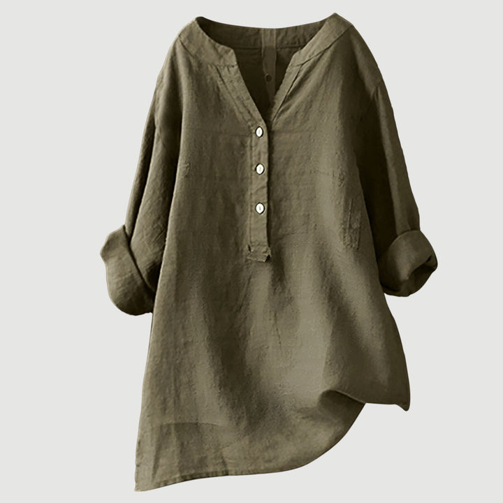 Casual short-sleeve linen top on a plain background.