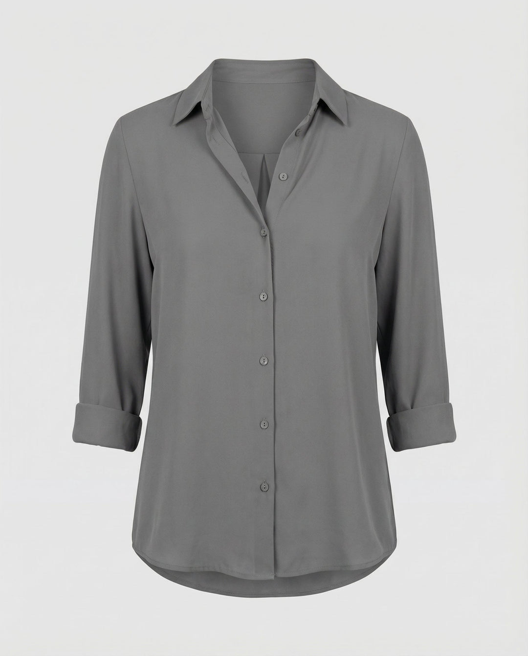 Collared blouse with button placket styling.