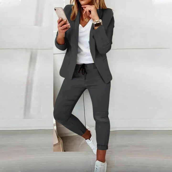 Female wearing a casual two-piece outfit with blazer and joggers.