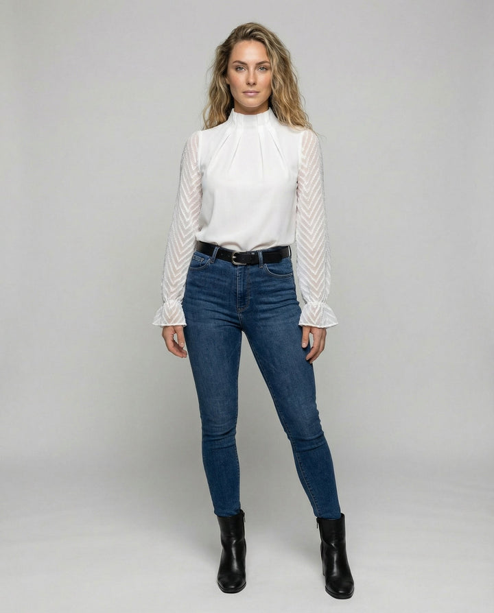 Female modelling a timeless long-sleeved top with a flattering fit.