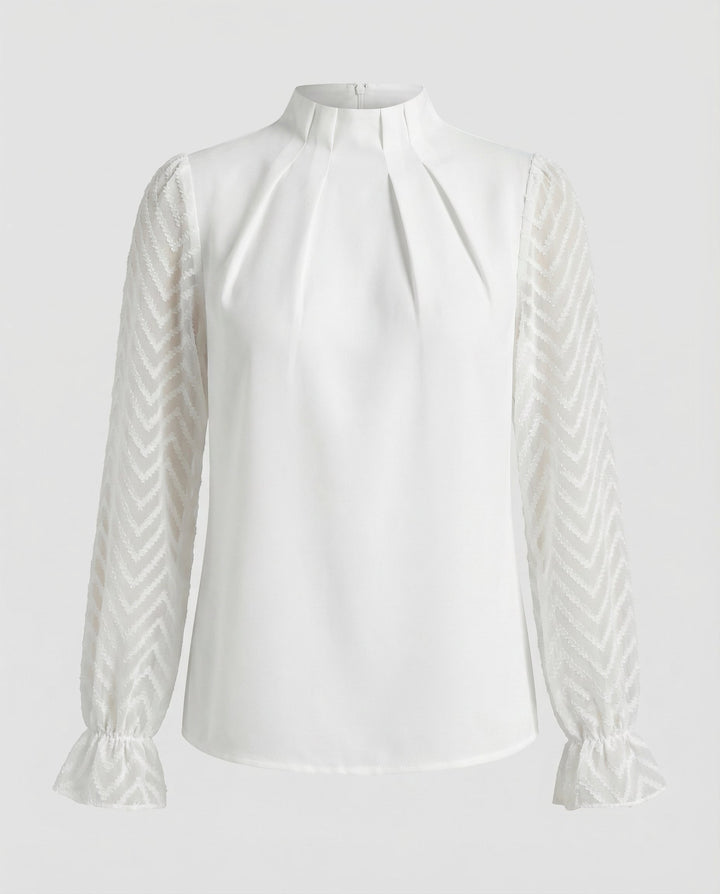 Modern long-sleeved top with a feminine shape.