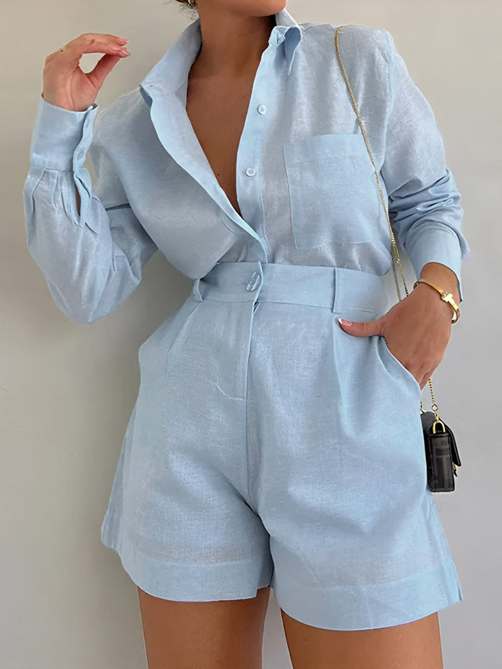Woman wearing a long sleeve co ord set on a plain background.