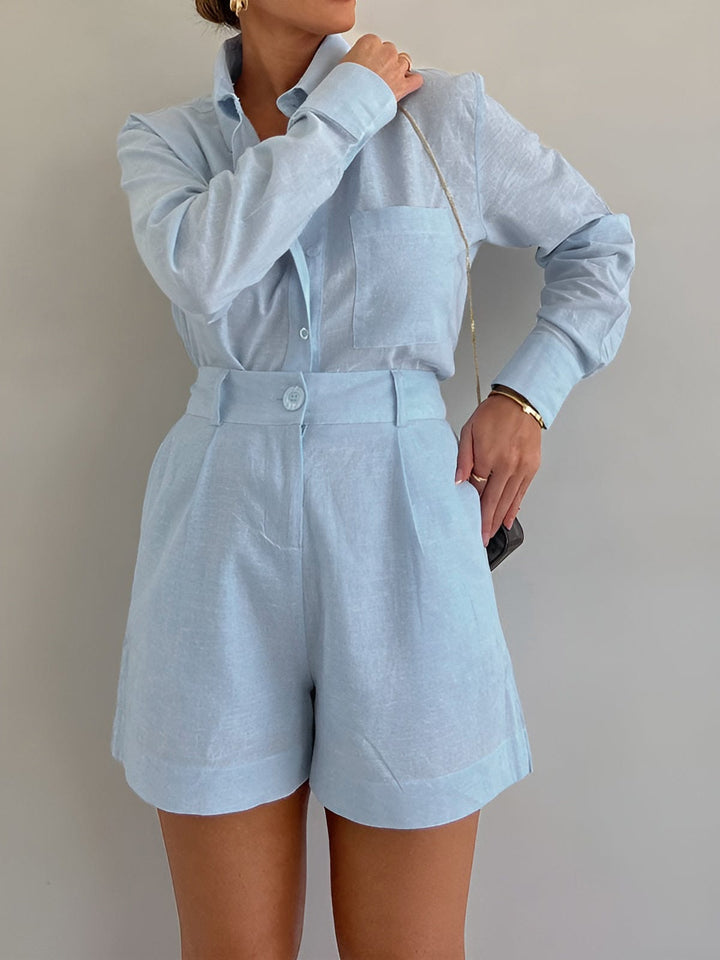 Woman styled in a long sleeve matching set on a plain background.