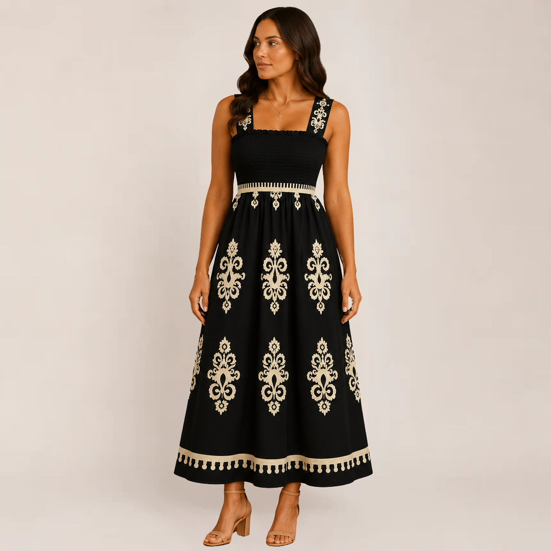 Woman modeling a lightweight floor-length summer dress on a plain background.