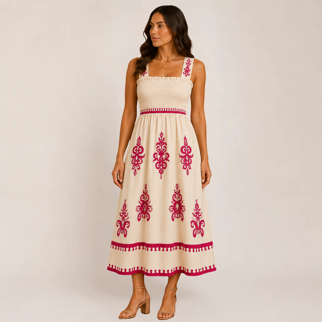 Female in a relaxed flowy maxi dress with sleeveless styling on a plain background.