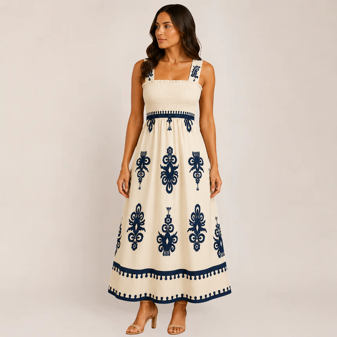 Female showcasing a breezy long summer dress on a plain background.