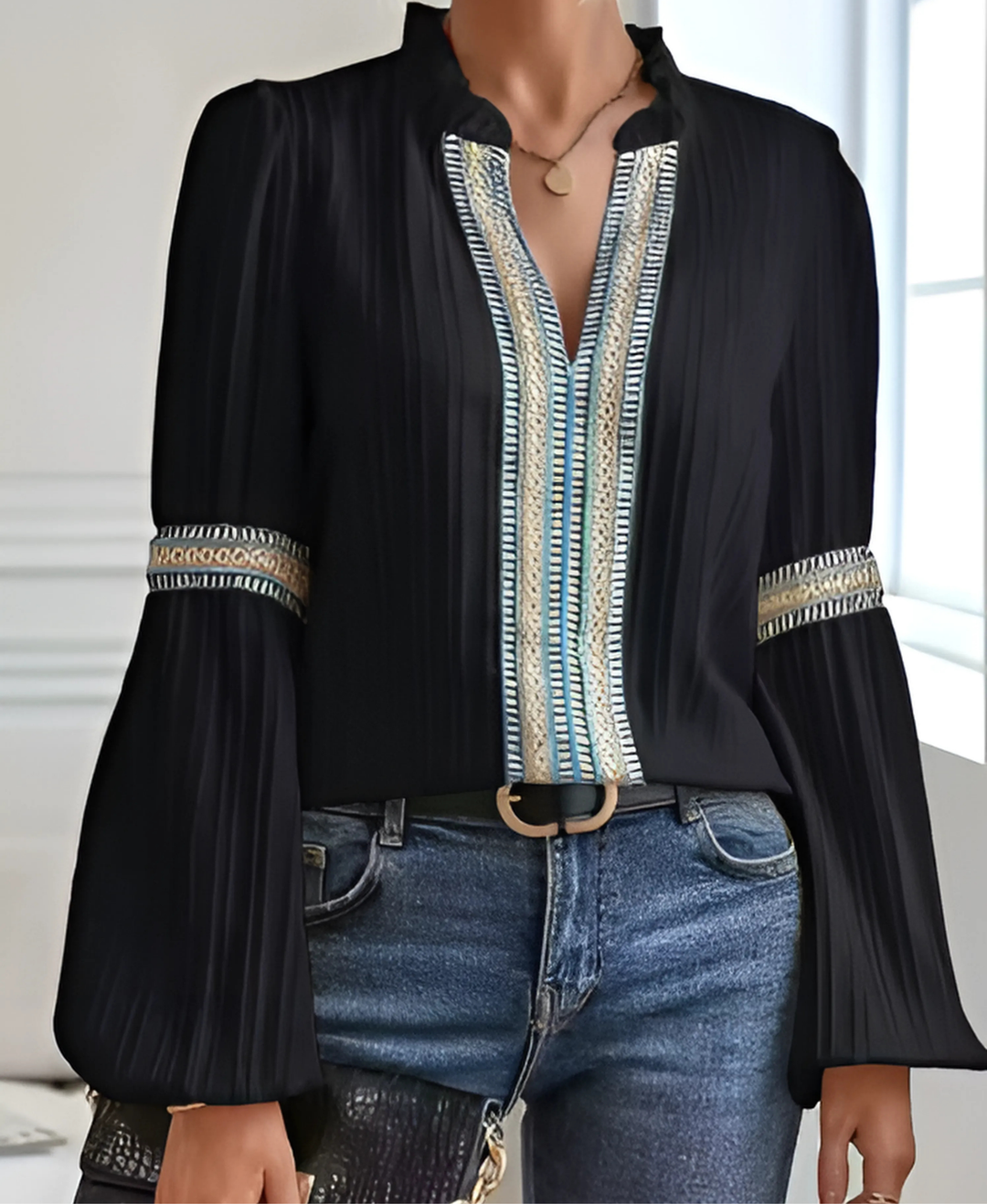 Female model styled in a vintage-inspired top for everyday outfits on a plain background.