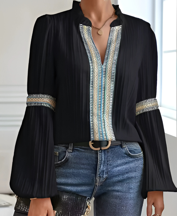 Female model styled in a vintage-inspired top for everyday outfits on a plain background.