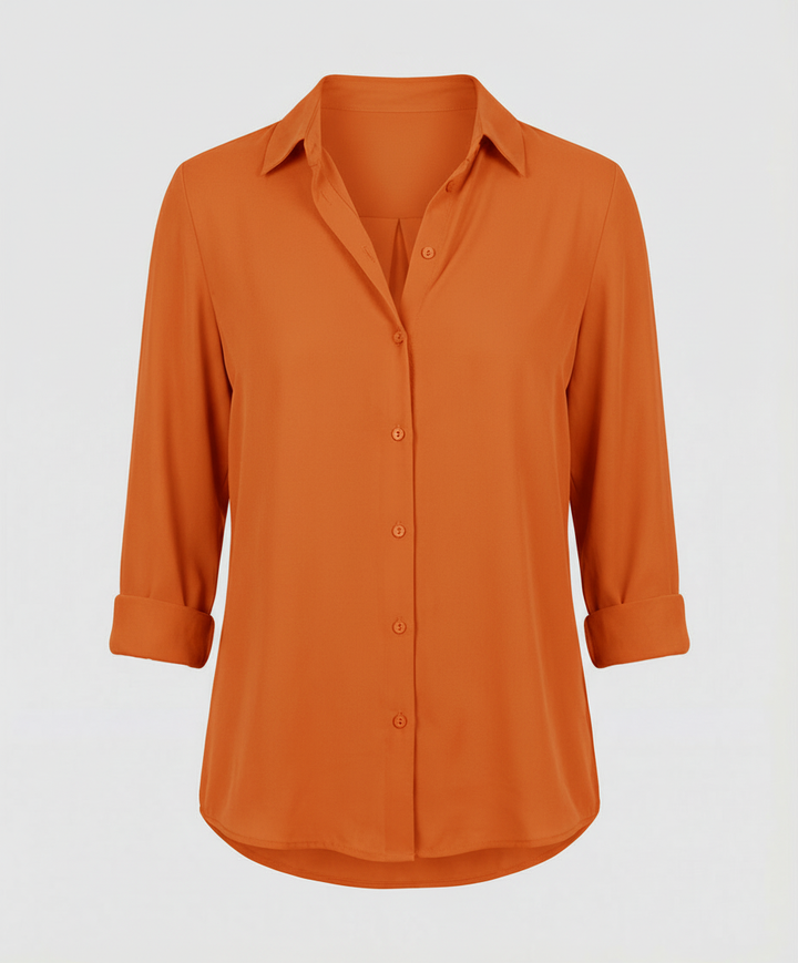 Soft button-front blouse on a plain background.