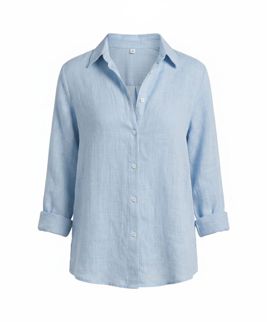 Woman modelling a stylish blouse suitable for office wear.