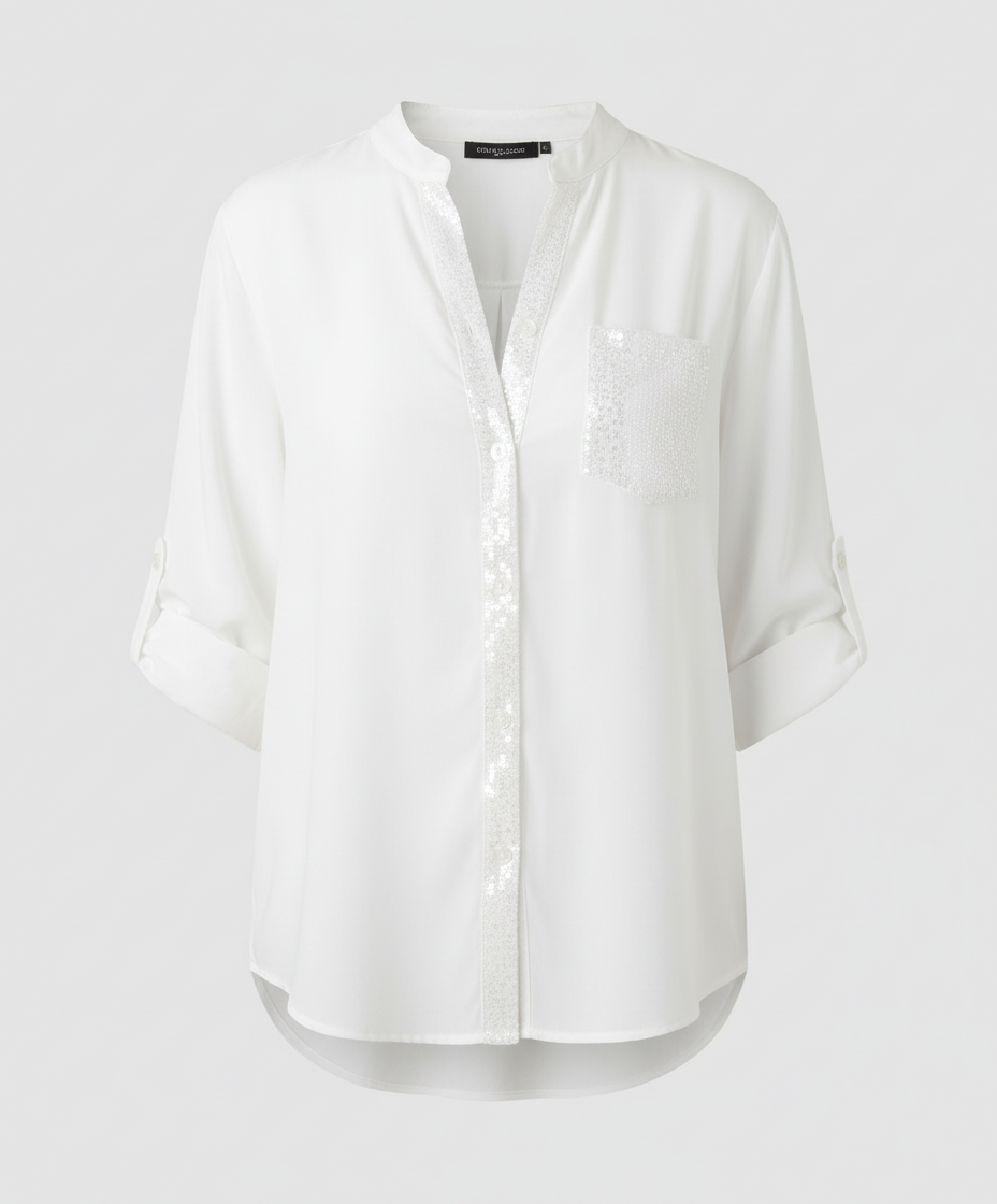 Loose glitter blouse with decorative sequined chest pocket.
