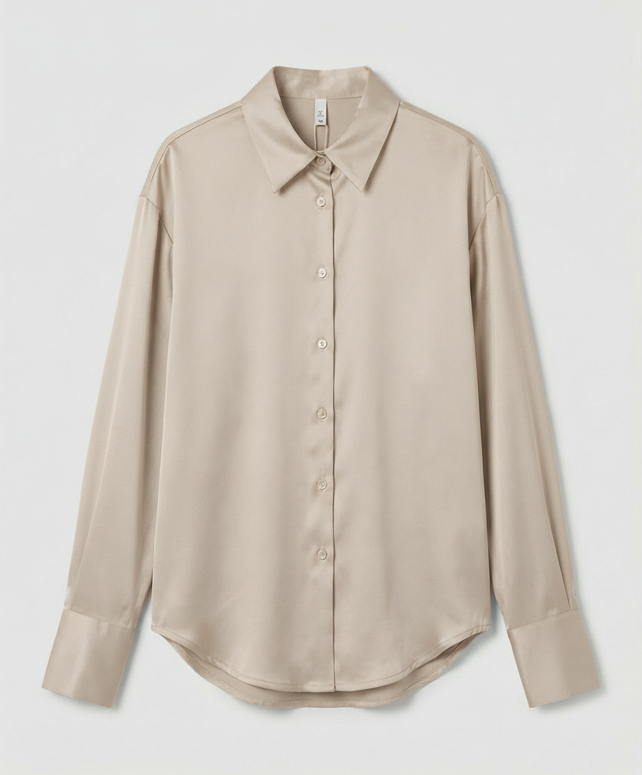 An elegant silk blouse with detailed finishing.