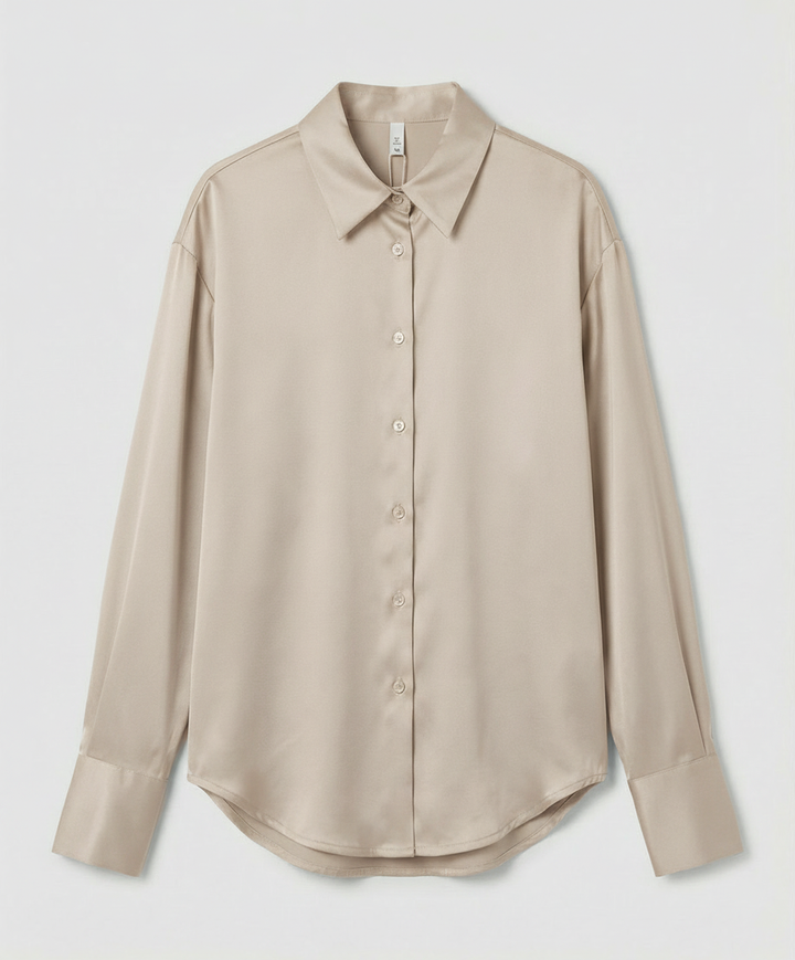 An elegant silk blouse with detailed finishing.