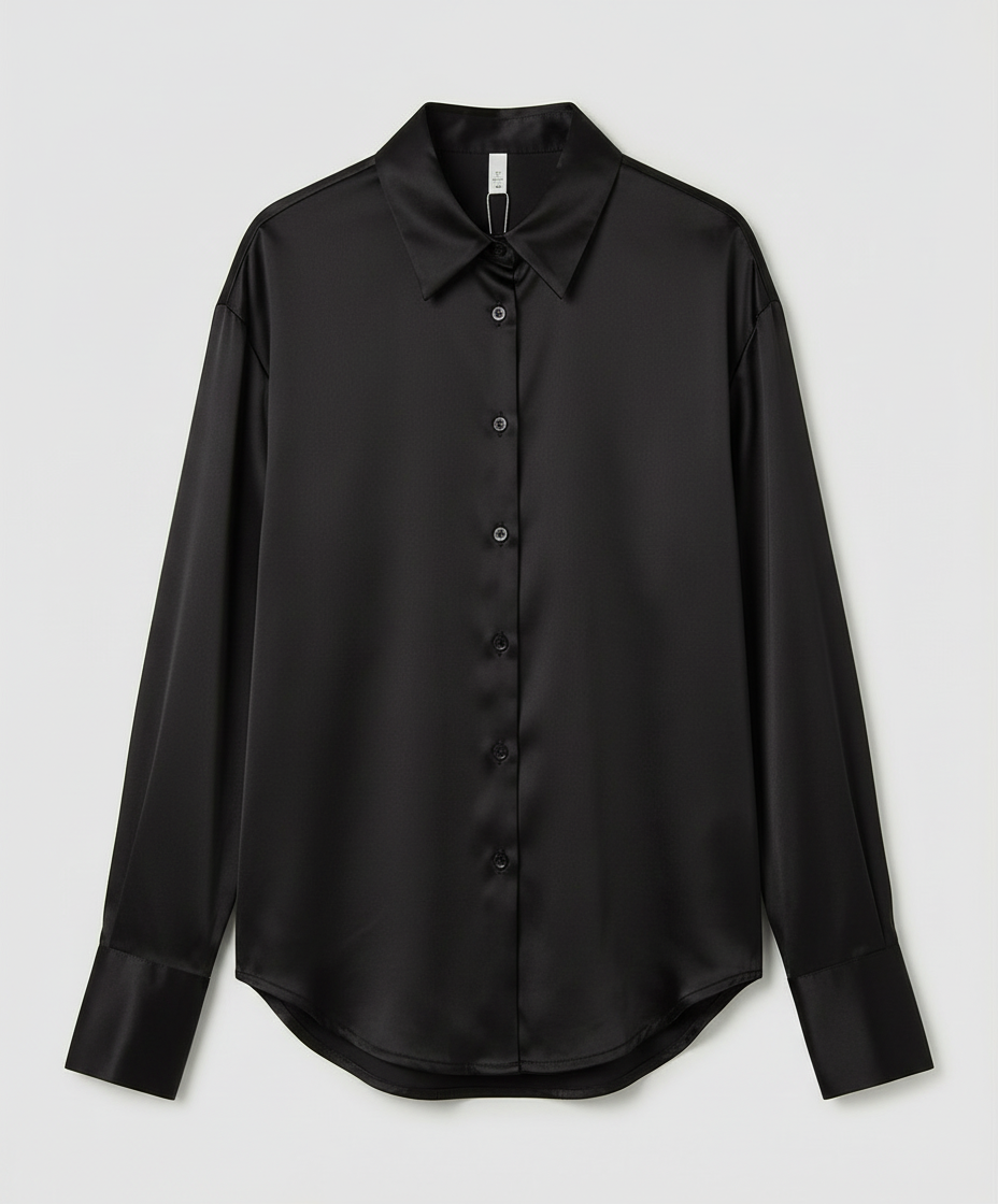 Long sleeve silk blouse on a plain background.