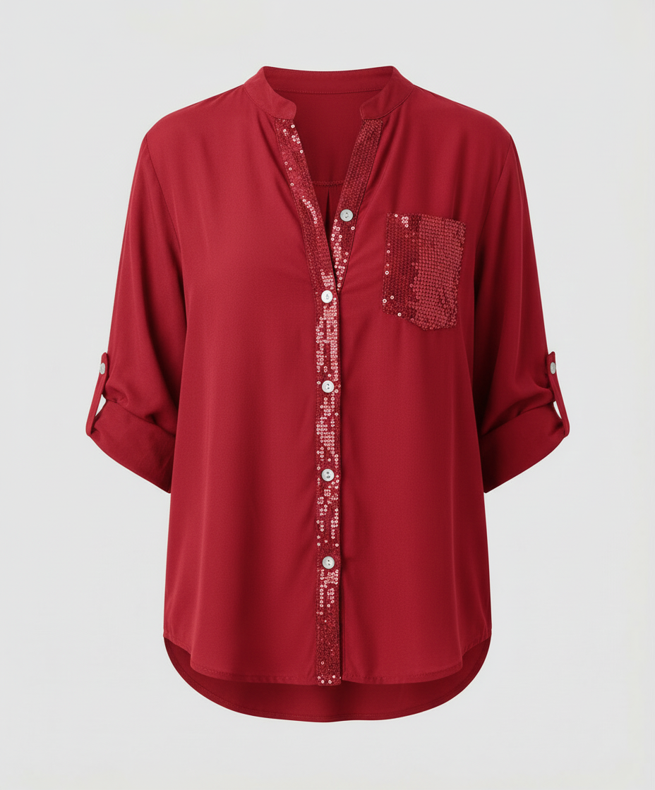 Shimmer blouse with loose sleeves and pocket detail.