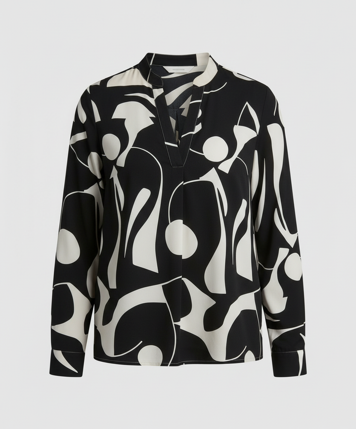 Relaxed fit blouse against a plain background.