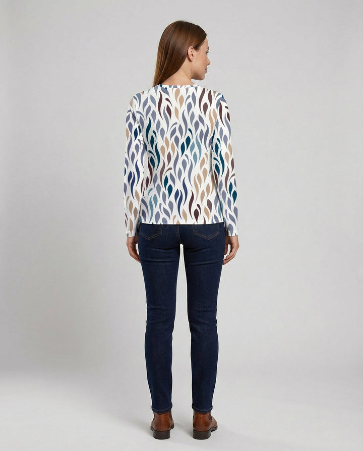 Woman in a stylish everyday T-shirt on a plain background.