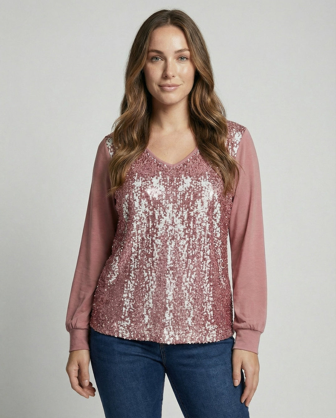 Glitter blouse with subtle sequin details against a plain background.