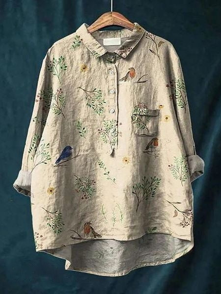 A long-sleeve floral blouse with an elegant drape.
