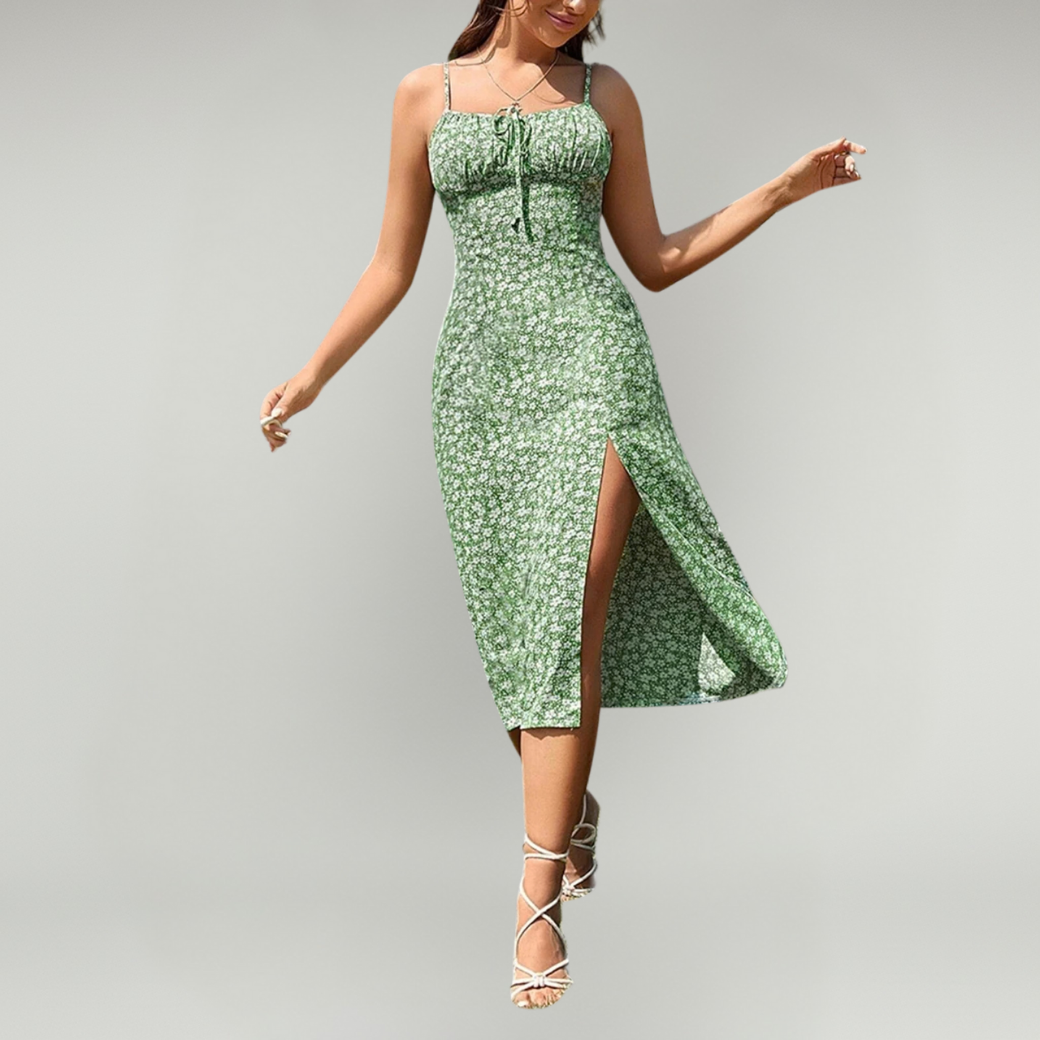 Female model in a floral midi dress styled for warm-weather casual wear.
