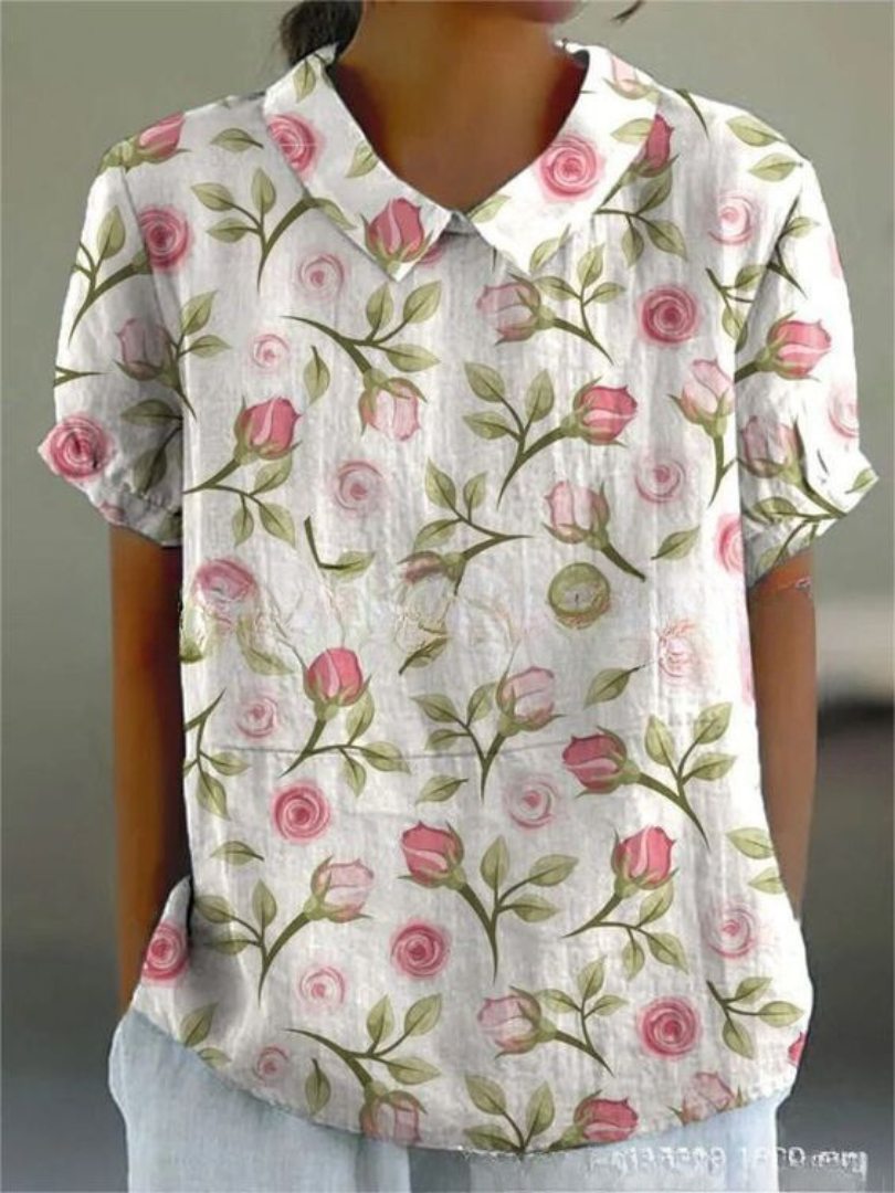 Woman modelling a floral shirt with a loose and comfortable fit.